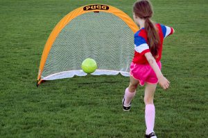 Girl shooting on Pugg 6 footer Pop-Up Goal